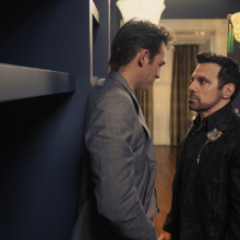 Giuseppe (Sebastiano Pigazzi) and Anthony (Mario Cantone) stand in Carrie's closet facing each other 