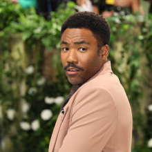 Donald glover posing for a camera