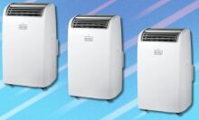 three Black+Decker portable air conditioner units sit in a line on a light blue background with white streaks running through it