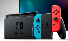 a nintendo switch with its joy-cons in a comfort grip in front of a tv screen