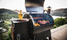 A Traeger grill loaded up with food