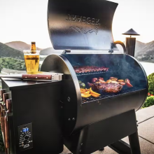 A Traeger grill loaded up with food