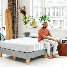 Person sitting on a Leesa Original Mattress.