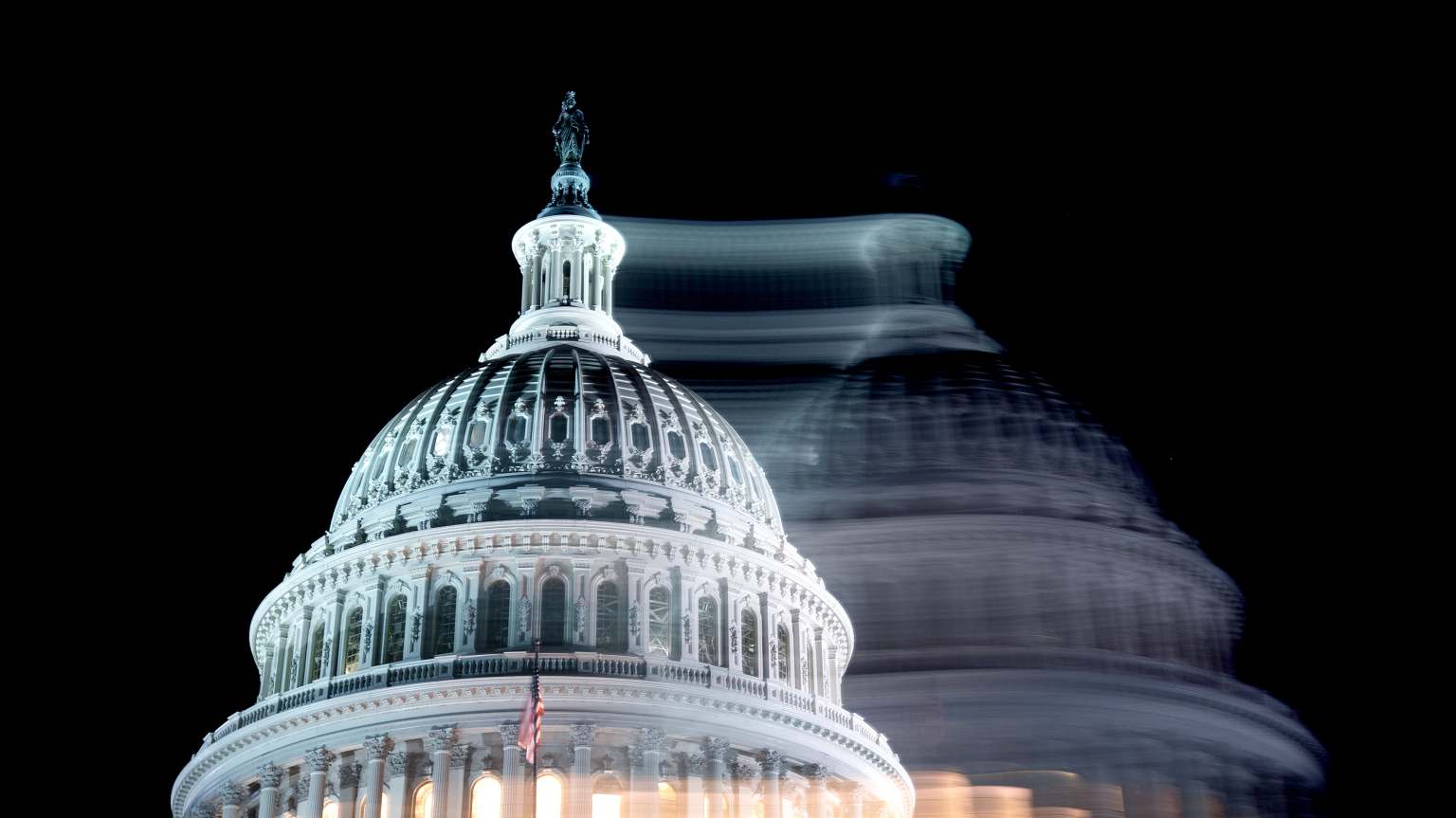 A photo of the U.S. capitol dome, blurred to look as if there are two of them.