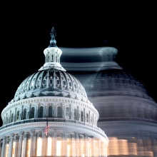 A photo of the U.S. capitol dome, blurred to look as if there are two of them.