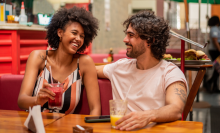 Couple drinking juice at restaurant - stock photo