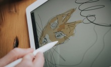 Person using the Refurbished Apple iPad Pro 9.7".