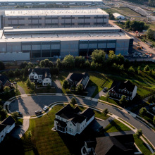 An aerial shot of an Amazon data center, right next to a residential neighborhood. 