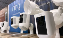 Ring security cameras are displayed on a shelf at a Best Buy store.