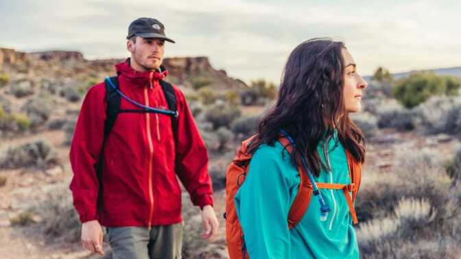 Two hikers wear Gregory backpacks 