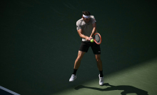 USA's Taylor Fritz hits a return