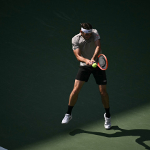 USA's Taylor Fritz hits a return