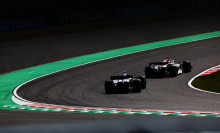 Kevin Magnussen of Denmark leads Pierre Gasly