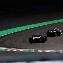 Kevin Magnussen of Denmark leads Pierre Gasly