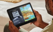 Person using an Amazon Fire HD 10 tablet