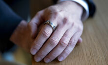Oura Ring on man's finger