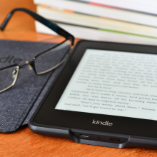 LONDON - JULY 16: Amazon Kindle paper white e book reader. July 16, 2014 in London, UK.