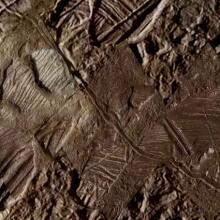 A view of the icy, cracked surface of Jupiter's moon Europa.