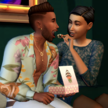 one sim romantically feeding a strawberry to another