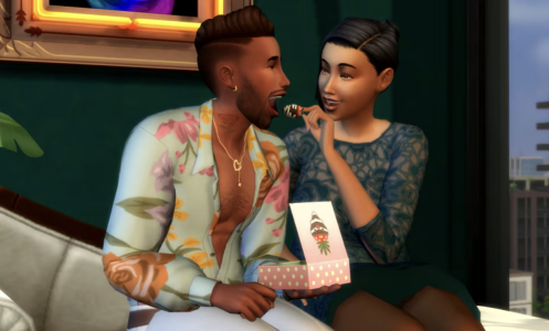 one sim romantically feeding a strawberry to another
