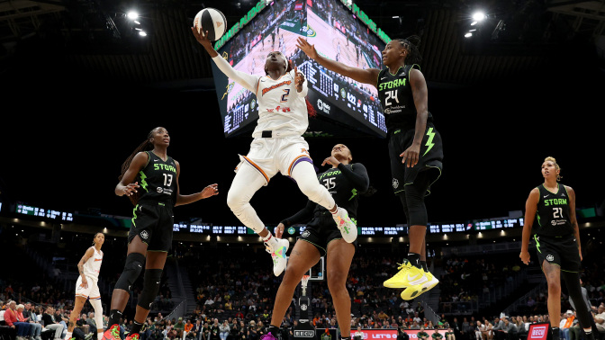 Kahleah Copper of the Phoenix Mercury shoots against Jewell Loyd of the Seattle Storm