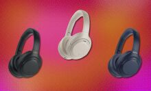 three pairs of the Sony WH-1000XM4 headphones on a background that's pink and orange