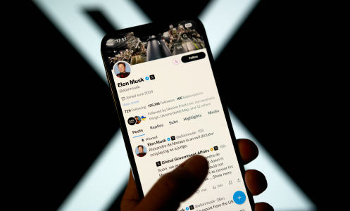 elon musk x page on phone in front o x logo background