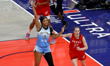 Chicago Sky forward Angel Reese is guarded by Indiana Fever guard Caitlin Clark