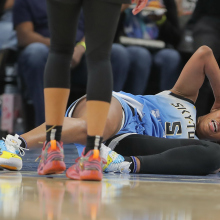  Angel Reese #5 of the Chicago Sky lays on the court 