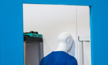 The back of a mannequin's head in a storage closet at CES