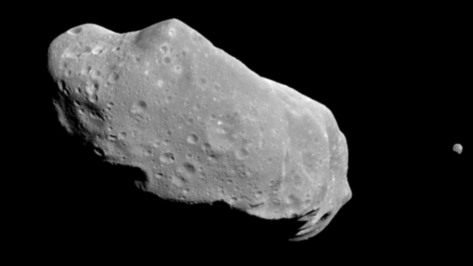 The asteroid 243 Ida and its small moon as imaged by NASA's Galileo spacecraft in August 1993.