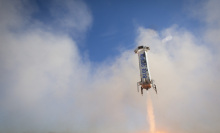 Jeff Bezos' Blue Origin launches and lands its rocket for a third time