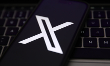 X logo on mobile device