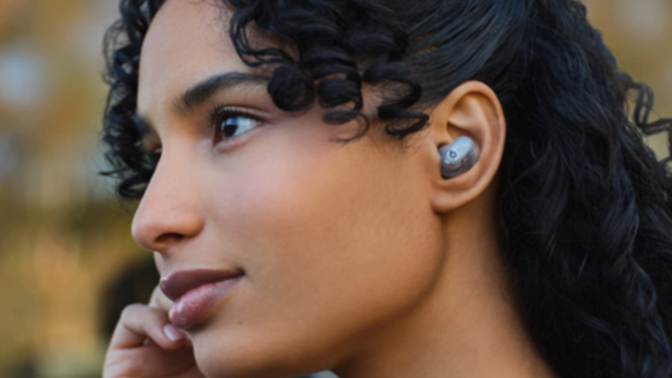 Women listening to music with wireless buds