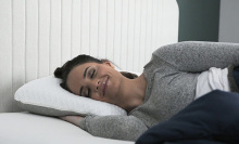 Woman sleeping on a CarbonIce pillow.