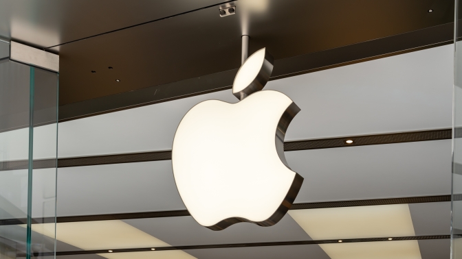 Close up of the apple store logo on a glass window