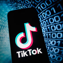 TikTok logo in front of binary code