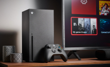 an xbox series x sits on a table next to a TV