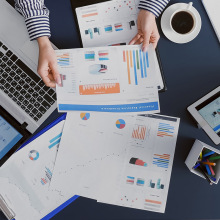 A person looking at charts at their desk