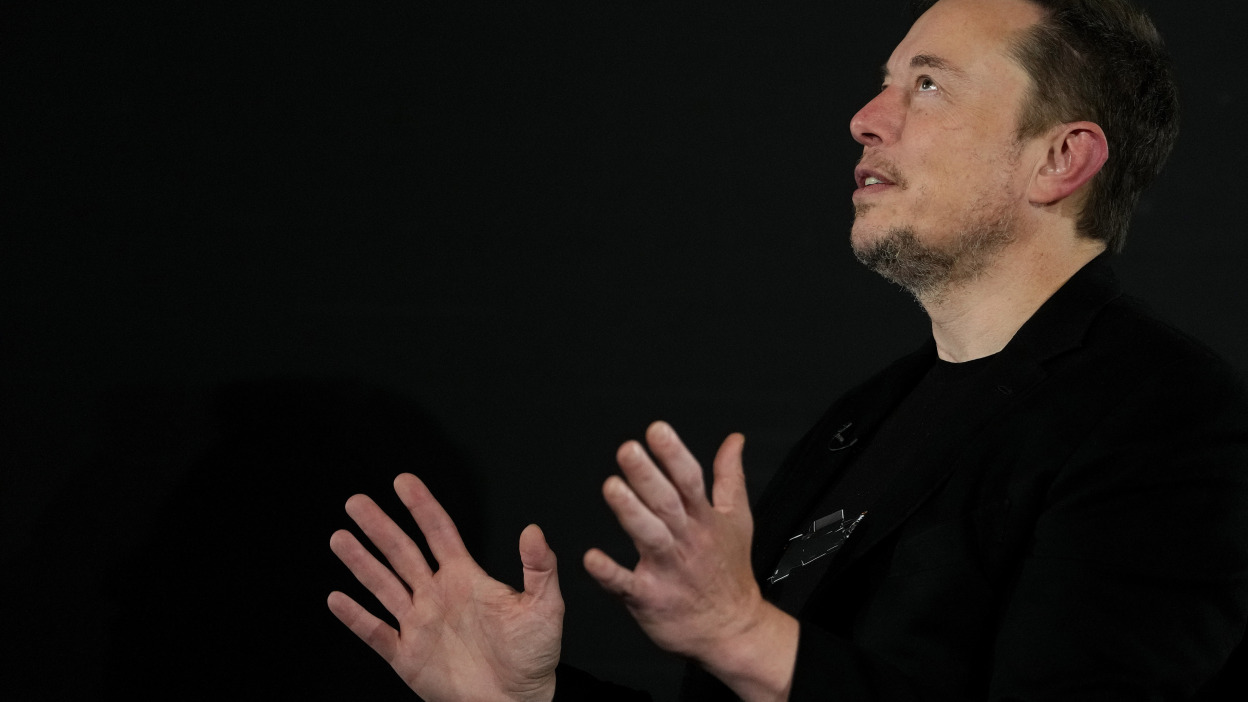 Elon Musk talking with his hands. 