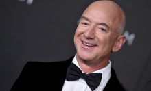 Former Amazon CEO Jeff Bezos wearing a tuxedo and smiling.