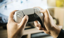 a person holding a playstation controller