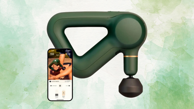 A green Theragun Prime massage gun next to a smartphone displaying the Therabody app.