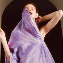 woman in a sheer purple blanket 