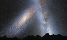 A hypothetical view from Earth as the Andromeda galaxy (on left) is about to collide with part of the Milky Way galaxy. 