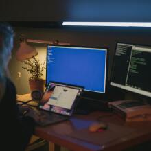 Person staring at multiple screens