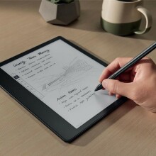 a person writes on the amazon kindle scribe with the included pen