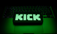 A laptop keyboard and Kick logo