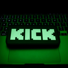 A laptop keyboard and Kick logo