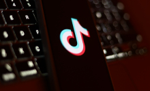 TikTok logo on a phone screen